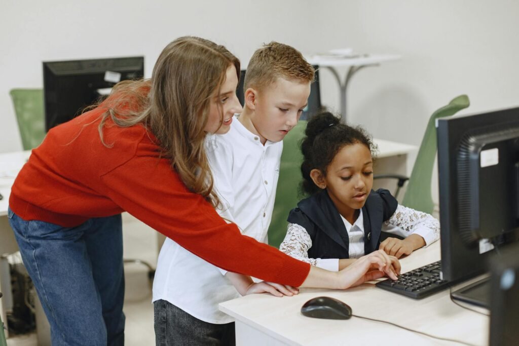 A teacher helps two children as they collaborate on a computer, engaged in a fun learning activity together.

The BEST Teacher Training Institute in Mumbai Borivali 