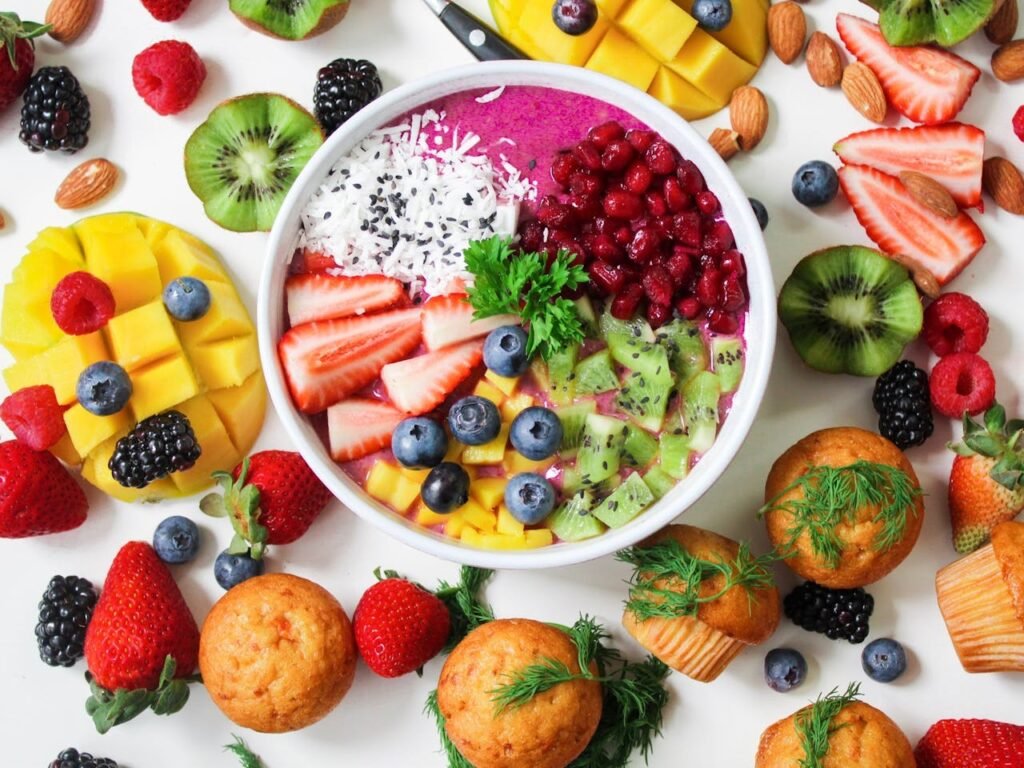 A colorful bowl filled with a variety of fresh fruits and vegetables, showcasing nature's vibrant bounty.