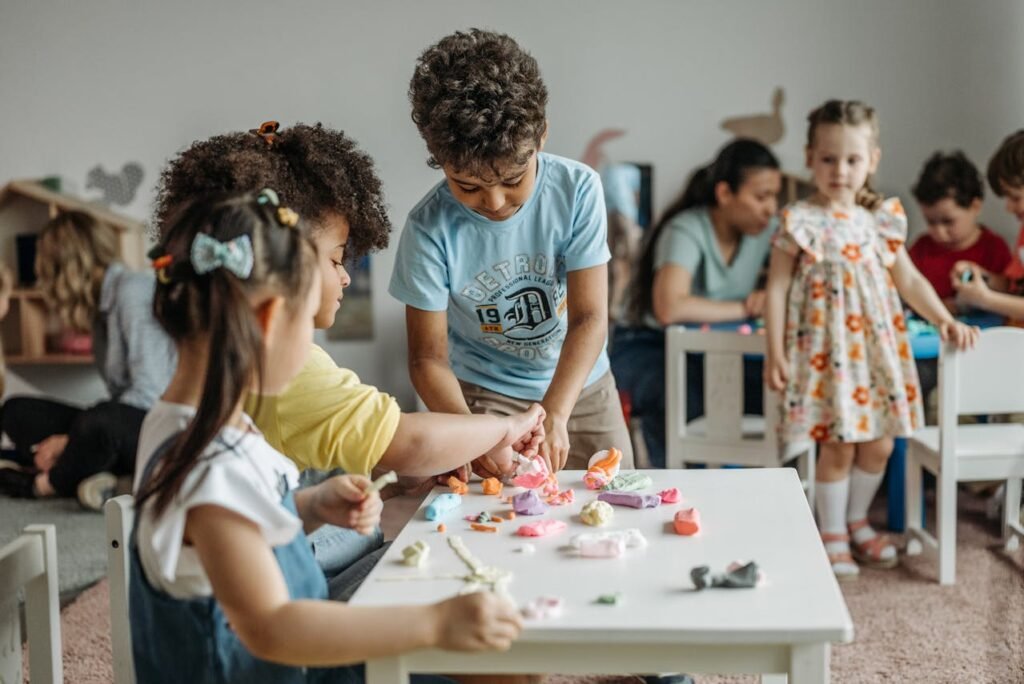 children playing with the clay in the classroom
