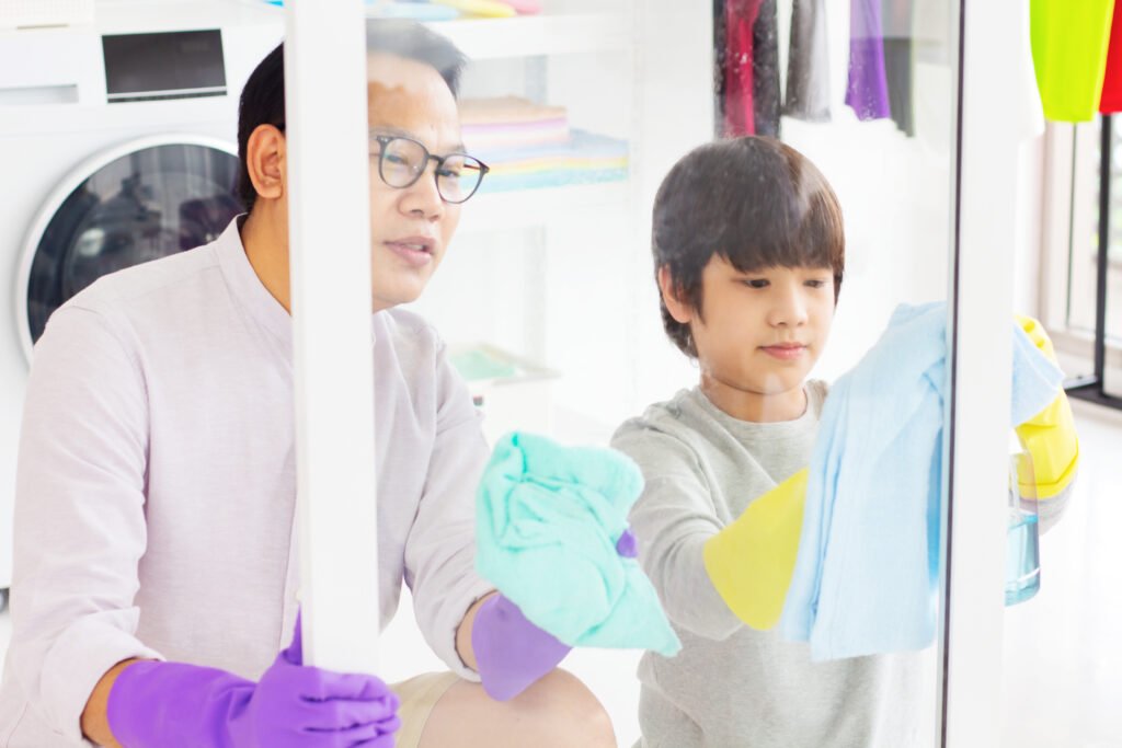 father-and-son-wiping-the-glass_