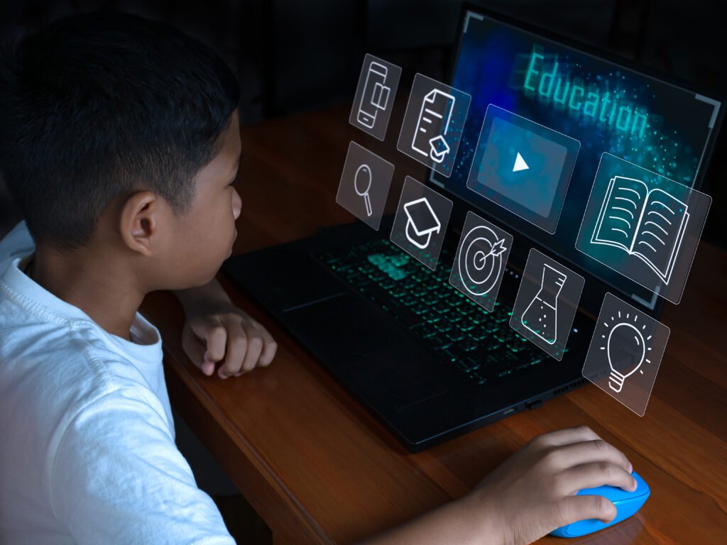 close-up-the-boy-sits-staring-at-the-laptop-and-his-hand.